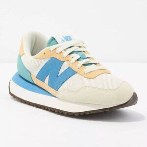 New Balance Women's 237 Sneaker with Peach/Blue/Cream colors, size 9